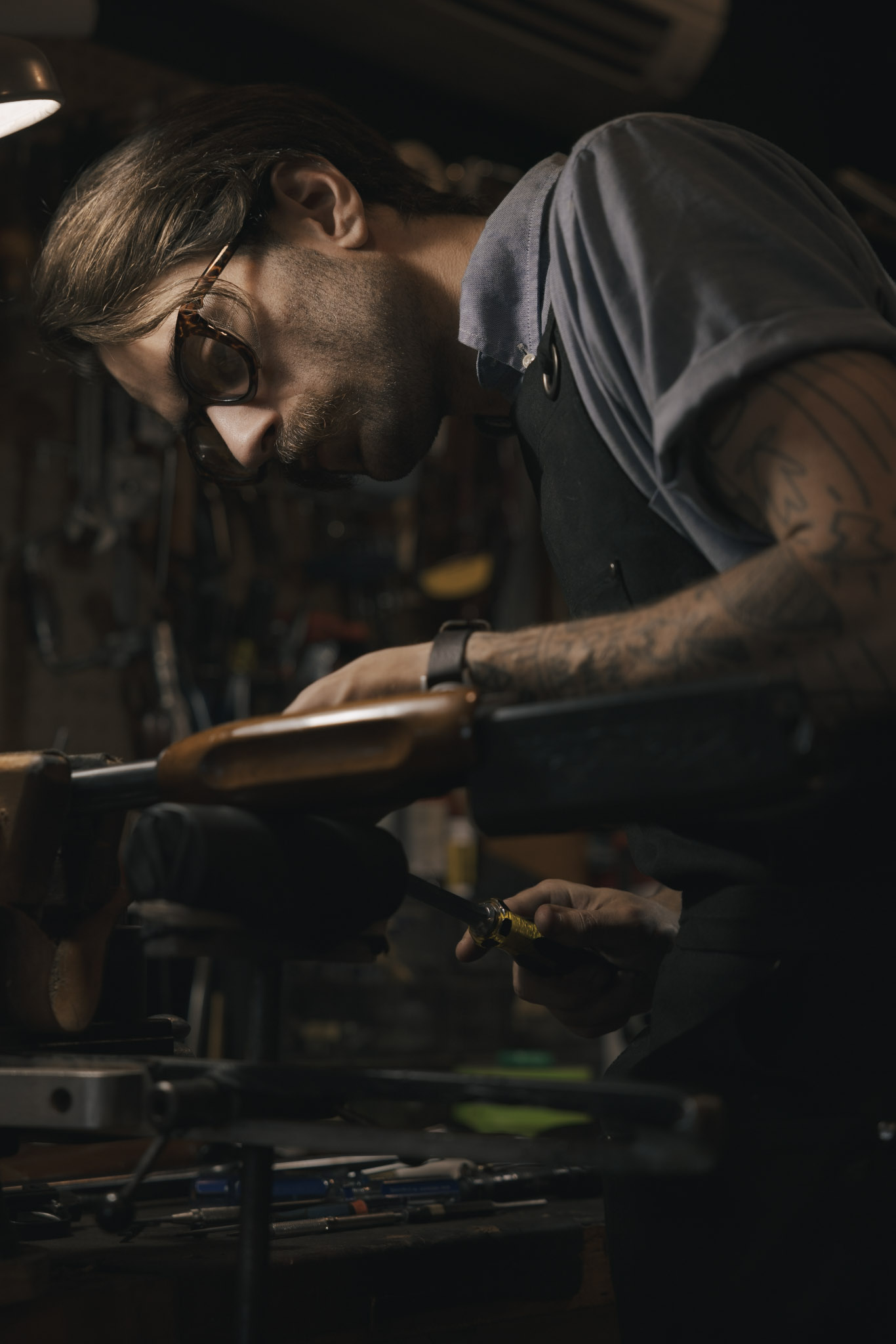 Connor at work on a shotgun stock at the bench